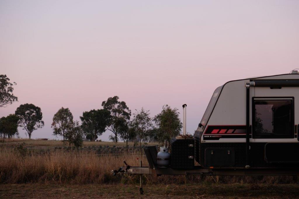 Caravan parked at Goombungee caravan park Back Paddock Botanical
