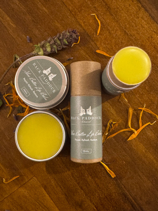Shea butter lip balm shown open in tin and tube forms
