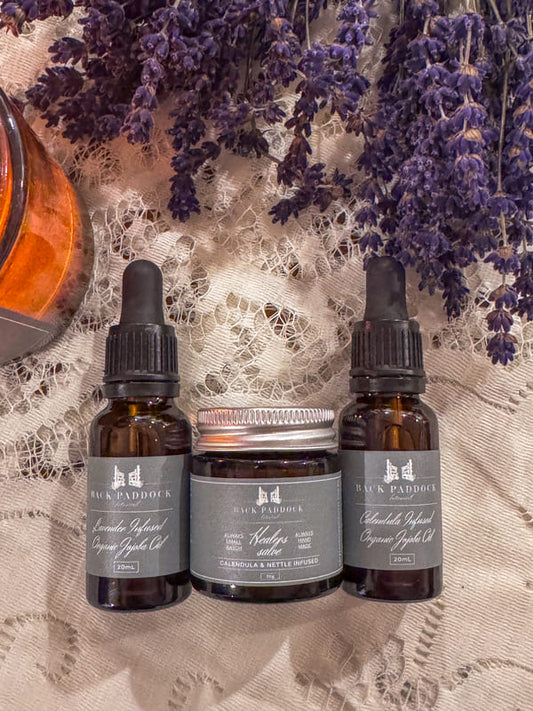 Three bottles of back paddock botanical products